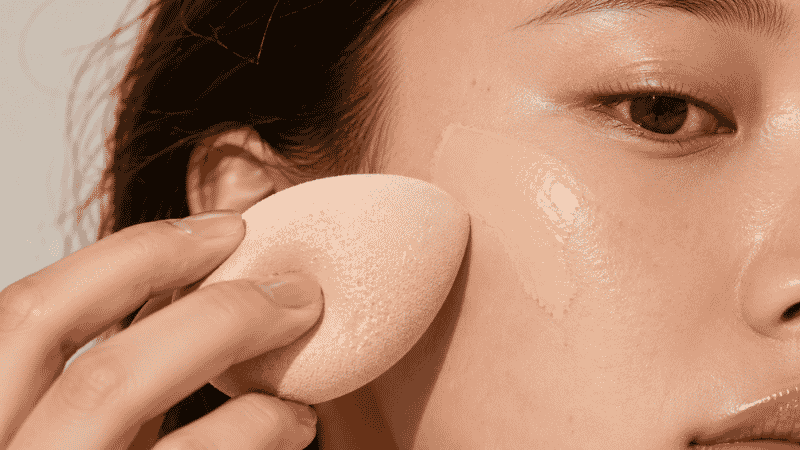 Foundation applied with a beauty sponge followed by concealer under the eyes