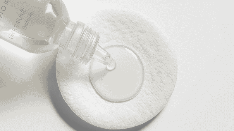 Salicylic acid BHA exfoliant product for oily skin showing clear liquid formula on a cotton pad