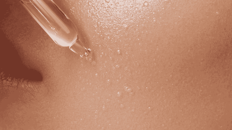 Hyaluronic acid serum being applied to slightly damp skin immediately after cleansing for maximum absorption