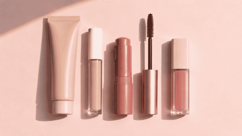 Five drugstore products for a no makeup makeup look — skin tint concealer cream blush mascara and lip gloss