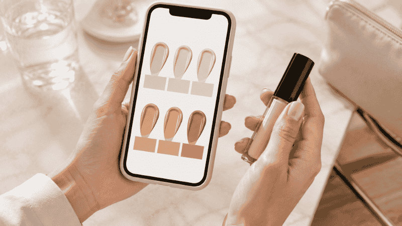 Person looking at phone comparing foundation shade swatches online showing how to shop for foundation shade without going to store