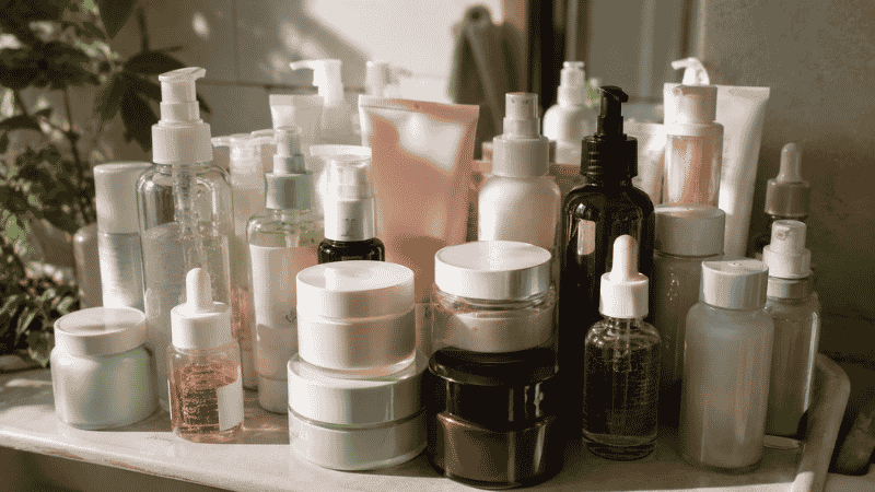 Too many skincare products crowded together showing the common beginner mistake of using too much at once
