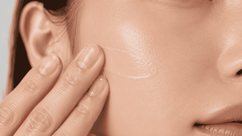 Lightweight oil-free tinted moisturizer being applied to oily skin showing a natural non-greasy finish